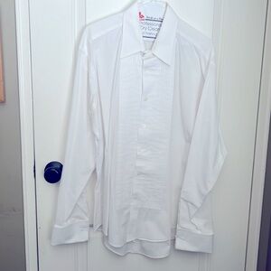Tuxedo shirt with pleats in front.  Button holes for the studs. Are length 34/35